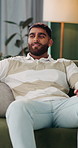 Break, smile and thinking with man on sofa in living room of home for me time or reflection. Inspiration, relax and vision with happy person in apartment for mindfulness, self care or wellness