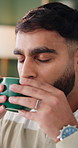 Man, coffee and drink in home with thinking for reflection, break or relax on lounge sofa. Person, eyes closed and perspective with beverage, caffeine or flavor on couch in living room of house