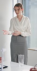 Businesswoman, presentation or talk in office with windmill, renewable energy or sustainable project. Person, speaking or proposal in workshop with wind turbine, eco friendly power generation or plan