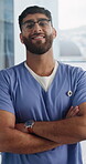 Face, nurse and man with arms crossed in clinic, happy and confident with healthcare career and duty. Medical professional, portrait and person with smile, pride and wellness services in hospital