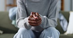 Hands, nervous and person with anxiety for counseling, anticipation or habit for coping mechanism. Patient, fidget and worry on sofa with stimming, trauma response and self control for emotional ptsd