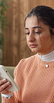Frustrated, woman and stress in home with phone, bad news and disappointed for online criticism. Sad, female person and upset reaction at house with mobile, negative message and social media gossip