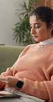 Credit card, laptop and typing with woman on sofa for online shopping, app sale and ecommerce. Fintech, customer purchase and banking with person in living room of home for digital subscription