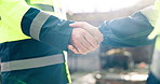 Architect, meeting and handshake with deal on construction site for teamwork or agreement. Contractor, civil engineer or shaking hands with colleague for b2b, partnership or building development