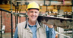Construction, face or man on site with plank, positive attitude or pride as industrial worker. Happy, mature person or engineer with wood material, about us and confidence in architecture industry.