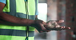 Hands, engineer and discomfort at site with wrist pain, injury and accident from construction. Person, contractor and massage with palm inflammation, osteoporosis and symptoms from building incident