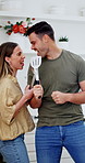 Singing, happy and couple in kitchen at house with music, playlist or radio for bonding with cooking. Smile, love and man with woman for karaoke on album with dancing together on weekend in home.