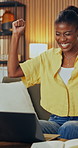 Fist pump, laptop and black woman in home on sofa with remote work for creative project with approval, Happy, computer and African female designer with positive feedback on email in living room.