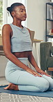 Breathing, yoga and black woman in home for wellness, health and self care in morning for calm. Relax, stretching and African female person with pilates exercise for balance in living room at house.