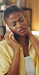 Phone call, communication and black woman on sofa with neck pain, injury or bad ergonomics in home. Remote work, cellphone and female person on mobile discussion with muscle sprain in living room.