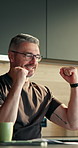 Winning, laptop and happy man with fist pump in home for success, achievement or promotion. Excited, male person or good news with applause on computer for accomplishment, bonus or salary increase