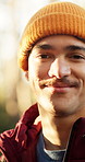 Face, man and smile with hike in woods for trekking, explore and adventure on holiday or travel. Outdoor, happy hiker and portrait for sunshine on vacation, journey and wellness in forest nature