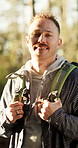 Face, man and smile with hike in forest for fresh air, explore and adventure on holiday or travel. Outdoor, happy hiker and portrait for sightseeing on vacation, backpacking or wellness in nature