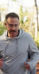 Breathing, fitness and running with man outdoor in nature for exercise or workout routine. Cardio, group and physical training with runner in forest for commitment or dedication to health activity