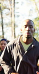 Breathing, exercise and running with man outdoor in nature for training or workout routine. Cardio, fitness and health group with runner in forest for commitment or dedication to physical activity