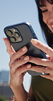 Business, texting and hands outdoor with phone, online chat and comic post on social media. Low angle, happy and employee in town with laughing, funny message or meme reaction on digital app.