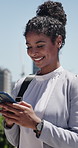 Laugh, texting and businesswoman in city with phone, online communication and comic post on social media. Happy, digital and employee in town with tech, funny message or meme reaction on chat app.