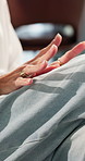 Impatient, hands and person with anxiety in waiting room, mental health or therapy session in clinic. Psychology, medical appointment and patient with depression, trauma and healthcare assessment