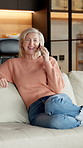 Laughing, phone call and relax with old woman on sofa in home living room for conversation. Communication, talking and thinking with funny senior person in apartment for break, retirement or wellness