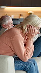 Annoyed, stress and sofa with senior woman in home living room for conflict, disagreement or fight. Argument, retirement and upset with unhappy couple in apartment for dispute or toxic relationship