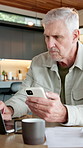 Old man, reading and phone in home with laptop, research and statement for finance expenses. Senior person, coffee and comparison at house with tech, financial invoice and payment for household bills