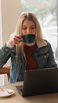 Coffee shop, happy and woman on laptop with drink for remote work, copywriting and website in cafe. Freelancer restaurant and person on computer for project, report and submission with cappuccino