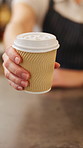 Serving, coffee shop and hands of woman with cup, drink and caffeine beverage for takeaway. Restaurant, counter and waitress with latte, espresso and customer order for service, help and hospitality