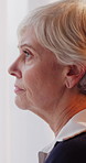 Thinking, unhappy or old woman in house with memory, loss or disappointment in past mistake. Mental health, reflection or senior person with depression, emotional fatigue or regret in retirement.