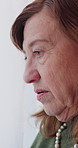 Thinking, sad or old woman in home with memory, loss or disappointment in past mistake. Mental health, reflection or senior person at window with breathing, emotional fatigue or regret in retirement
