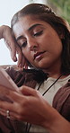 Sad, message and woman in home with phone, upset text or breakup in online communication. Unhappy, bad news and female person in house with tech, emotional chat or heartbreak response on dating site.