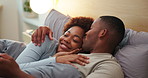 Happy couple, kiss and cuddle on bed, home and bonding with partner in bedroom, love and connection. Black people, smile and resting with spouse in house, affection and commitment for relationship