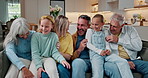 Big family, kids and tickle with generations in home, laugh and bonding together in living room. Grandparents, mother and father with girls for funny game, love or siblings playing for connection