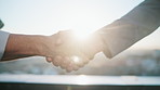 Real estate, handshake or people in city with deal, intro or partnership in sale agreement. Flare, greeting or realtors with shaking hands, property exchange or success in investment negotiation.