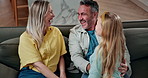 Laughing, child and smile with parents in home for care, support or connection together on sofa. Girl, daughter and funny joke with people in living room for family bonding, love with embrace