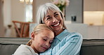 Hug, girl and smile with grandmother in living room for care, support or connection with generations. Child, granddaughter and embrace with senior person in home for family bonding, love and reunion