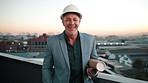 Face, man and architect in city with blueprint, smile and job experience for property development. Sunset, bokeh and mature person in urban town with floor plan, helmet and happy for architecture.
