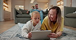 Tablet, mom and child on floor for learning, reading ebook and relax with daughter in family home. Tech, happy parent and bonding with girl for educational app, scroll and play with funny game