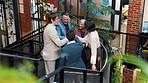 Creative office, stairs and people with hand stack, applause and success for remodeling contract. Collaboration, meeting and workers with solidarity, achievement and celebrate at interior design firm