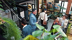 Team, walk and business people with greeting on stairs, insurance proposal or schedule in office. Collaboration, tablet and group at steps, hello or financial plan with policy paperwork from above