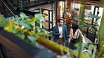 People, walk and talk in office with sustainable business, project planning or arrival at workplace. Coworkers, strategy and chat on stairs for eco friendly goals, environmentalist advice or meeting.