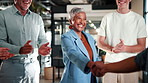 Shaking hands, meeting and business people with applause for partnership, deal or thank you in office. B2B merger, team and handshake for welcome, congratulations or client introduction for agreement
