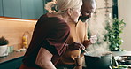 Cooking, smell and couple in kitchen at house with bonding, connection and love in marriage. Aroma, steam and mature man with woman for preparing meal, dish or dinner together on weekend in home.