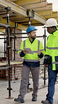 Architect, walking and men with tablet on roof, talking and planning for property development on web. Civil engineer, team and people with tech, discussion and building inspection updates on app