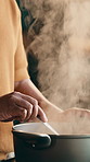 Man, hands and cooking with steam in pot for recipe, culinary art or meal prep in home. Male person, chef or stir with heat, smoke or hospitality skill for health, wellness or nutrition in house