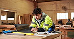 Laptop, blueprint and hands of construction worker on site for repairs, building or property development. Man, floor plan and civil engineer with technology for feedback on home renovation in office.