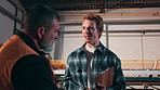 Construction, contractor and men with clipboard for meeting, planning and material for building project. Talking, warehouse and people with checklist, paperwork and inventory for infrastructure job