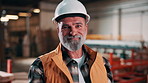 Carpentry, helmet or man in factory with face, hazard protection or pride as timber craftsman. Smile, hardhat or mature artisan with confidence, compliance or ppe gear in woodworking industry.