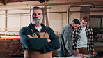 Manager, face and man in workshop for carpentry, manufacturing and wood production. Carpenter, portrait and person with smile, pride and team for timber business, furniture restoration or woodworking