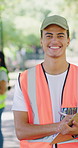 Volunteer, face and man with clipboard at park for cleanup project, earth day or community service. Sustainable NGO, team leader or waste checklist for environmental outreach, trash picking or happy