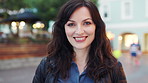 Happy, tourist and face of woman in city for travel, commute and trip for holiday, vacation and abroad. Smile, outdoor and portrait of person for tourism destination, explore and weekend in England